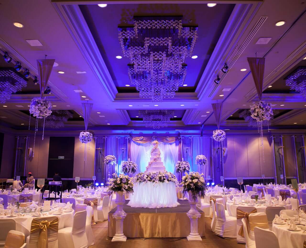 A large ballroom adorned for a wedding with top-notch DJ services in Maine.